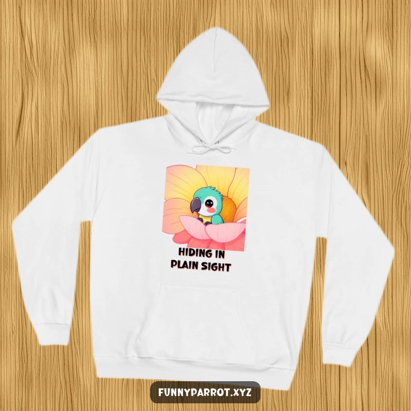 Funny curious parrot hoodie showing a parrot peeking from behind a giant, brightly colored flower, offering comfort and playful wonder.
